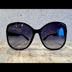 Jimmy Choo round glam oversized sunglasses, black with gold detailing.